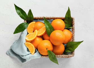 Box with fresh juicy oranges on white background