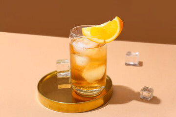Glass of delicious Old Fashioned Cocktail on color background