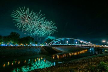 Beautiful Fireworks and light Chan Palace Bridge over the Nan River New Landmark It is a major tourist is Public places attraction Phitsanulok,Thailand,Twilight sunset.