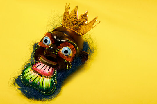 Moreno mask, with copy space and yellow background.