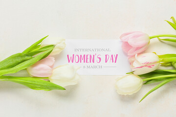 Greeting card with text INTERNATIONAL WOMEN'S DAY 8 MARCH and tulips on light background