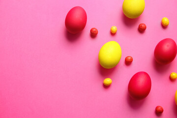 Red and yellow Easter eggs on color background