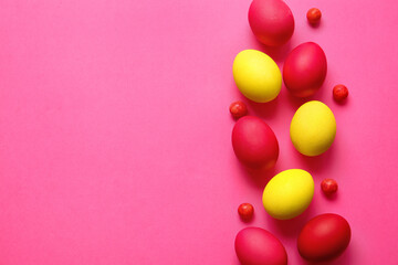 Red and yellow Easter eggs on color background