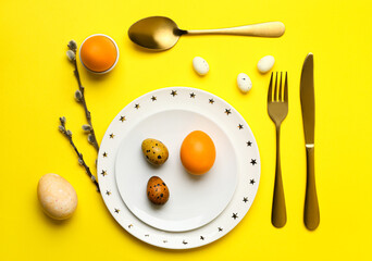 Beautiful table setting for Easter celebration on yellow background