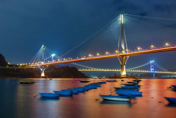 Idyllic landscape of bridge and bay in Hong Kong city at night