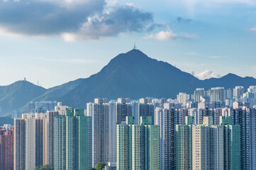 Obraz premium High rise residential building and mountain in Hong Kong city