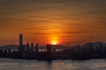 Obraz premium Scenery of sunset over skyline of Hong Kong city