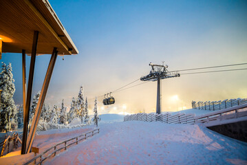 Ski lifts and ski slopes in the ski resort of Levi inside the Arctic Circle in Finnish Lapland,...