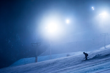 Ski lifts and ski slopes in the ski resort of Levi inside the Arctic Circle in Finnish Lapland,...
