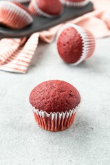 Red velvet muffins on a white background. Homemade cupcakes. Valentine day present. Selective focus.