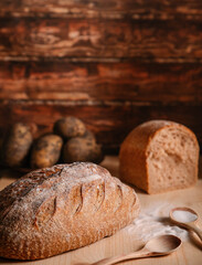bread with salt. bread on a dining wooden table. homemade bread from the oven. Russian national food