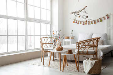 Interior of modern bedroom decorated for Easter celebration