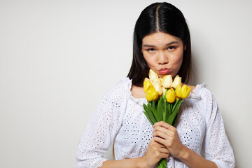 woman romance bouquet of flowers near the face studio model unaltered