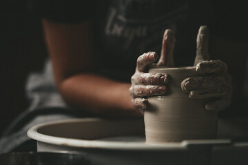 hands of a potter at work