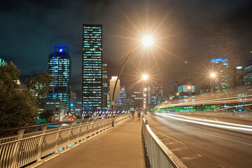 Fototapeta na wymiar Light Trails at Night Across the Bridge from Brisbane City Centre to South Bank, Queensland, Australia