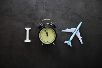 Big alarm clock. The clock is on the table. The inscription "time". Time for rest and travel.