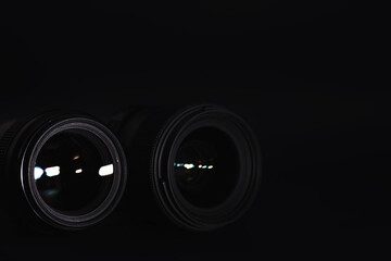 Optics to the camera on the operator’s desk. Flare in the glass of a photo lens. Background with...