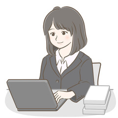 パソコンを操作するスーツの若い女性