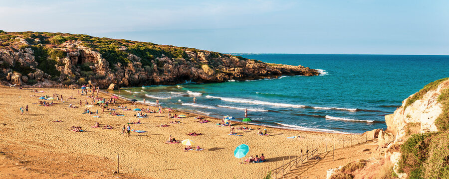 Calamosche Beach, panoramic photo of people sunbathing on the beach near Noto in the Vendicari Nature Reserve, South East Sicily, Italy, Europe
