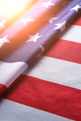 Fototapeta na wymiar Flag United States of America in bright rays sun.Star spangled flag is symbol democracy and freedom.