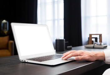 Laptop mockup. Hand of businessman working on computer with blank screen in office. High quality photo
