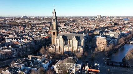 Amsterdam city center aerial drone view of the Westerkerk and the Jordaan urban area in the city center of Amsterdam. Along the canals.