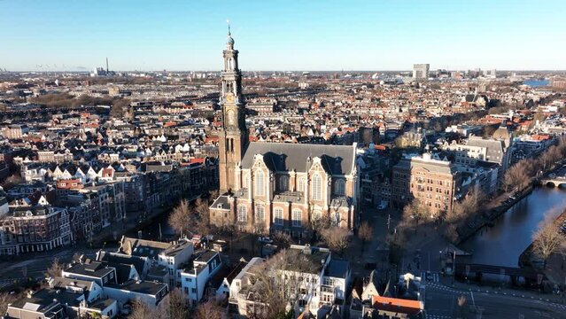Amsterdam city center aerial drone view of the Westerkerk and the Jordaan urban area in the city center of Amsterdam. Along the canals.