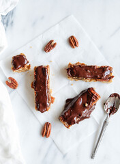 Delicious and healthy homemade snacks. Vegan Chocolate Bar with Nuts and Dates. Fresh ingredients...