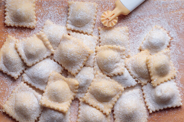 Top view of fresh Homemade Ravioli on Wooden Background
