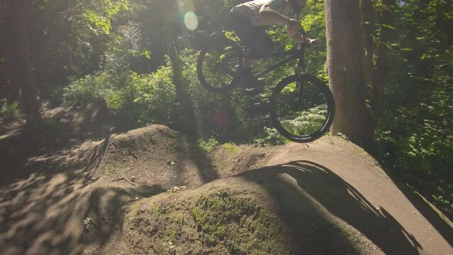Mountain Biker Riding Dirt Gap Jump Section Slow Motion