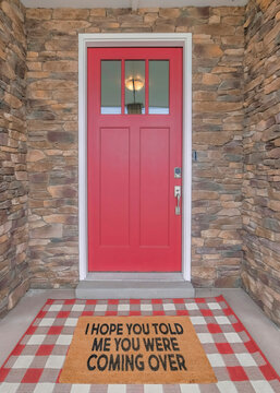 Vertical Red Front Door With Glass Panels And Funny Doormat Design