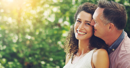 Hes the reason behind my smile. Shot of a happy and affectionate mature couple spending quality...