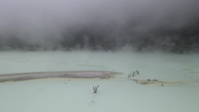 Aerial view fly through smoky in white crater, bandung, Indonesia