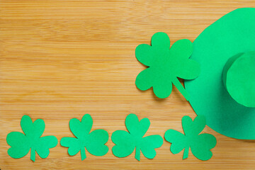 Happy Saint Patrick's Day , shamrock clover leaves with copy space on wooden Background.