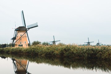 Aerial view of traditional windmills at sunset in Kinderdijk  Netherlands UNESCO heritage site 