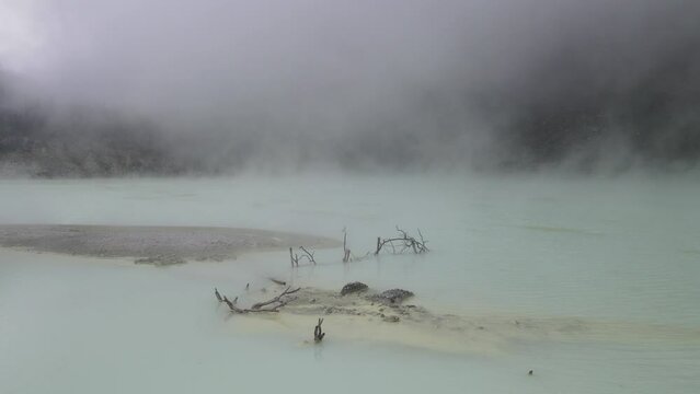 Aerial view fly through smoky in white crater, bandung, Indonesia