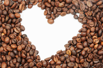 white heart on the background of coffee beans. coffee drinking concept. roasted coffee grain	