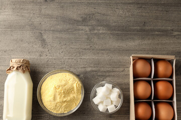 Ingredients for pie or cake cooking on wooden table
