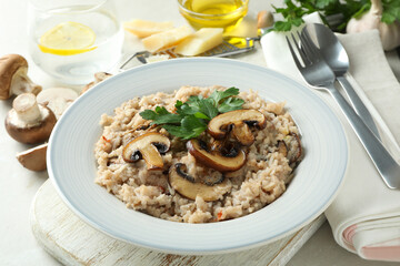 Concept of tasty food with risotto with mushrooms, close up
