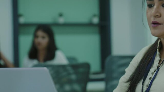 Stressed tired Indian businesswoman worker using laptop having project problem upset about mistake at workplace, overworked female employee working online frustrated about business failure in office.