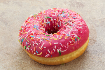 Sweet glazed struwberry donut with icing