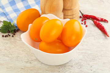 Sweet ripe yellow tomato in the bowl