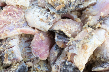 Pickled fish is fish that has been fermented with toasted rice and salt. It has sour and salty taste. It's one of food preservation in Northeastern of Thailand.