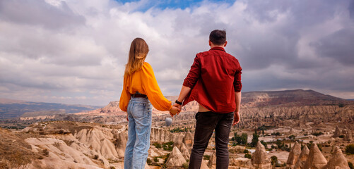 Young couple on hill in Cappadocia