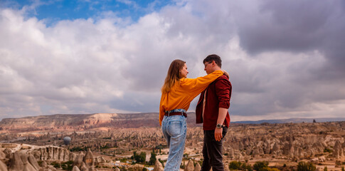 Young couple on hill in Cappadocia 