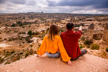 Young couple on hill in Cappadocia 