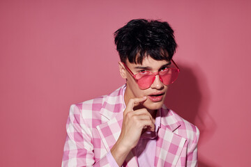A young man pink shirt and glasses jacket fashion elegant style isolated background unaltered