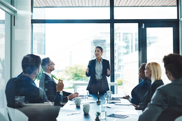 Getting down to the brass tacks. Cropped shot of an attractive young businesswoman giving a presentation in the boardroom.