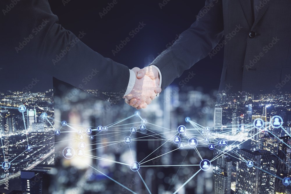 Poster abstract image of men shaking hands on blurry glowing polygonal network with people icons city backg