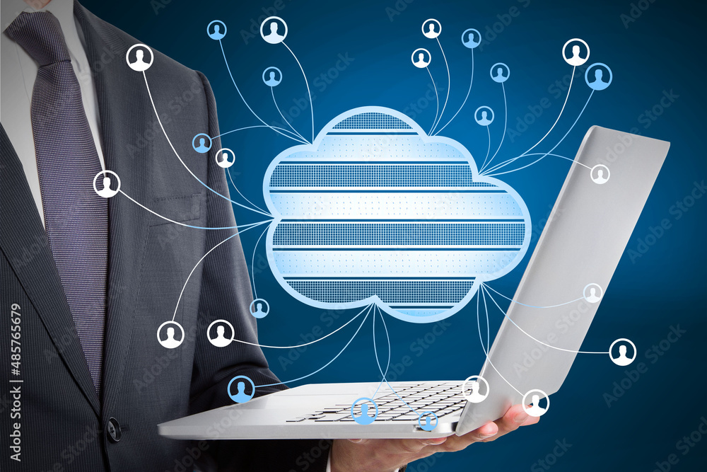 Poster close up of businessman hand holding laptop with abstract cloud computing hologram on blurry blue ba